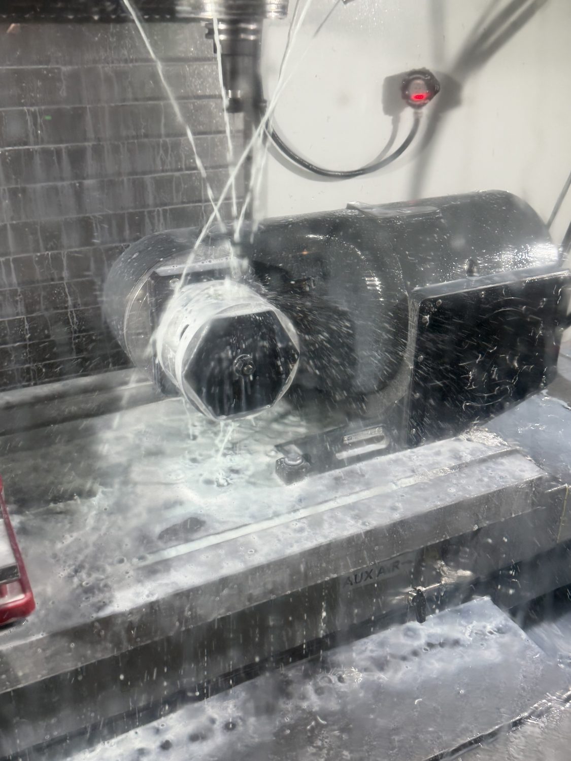 The core being machined on a five-axis mill under coolant