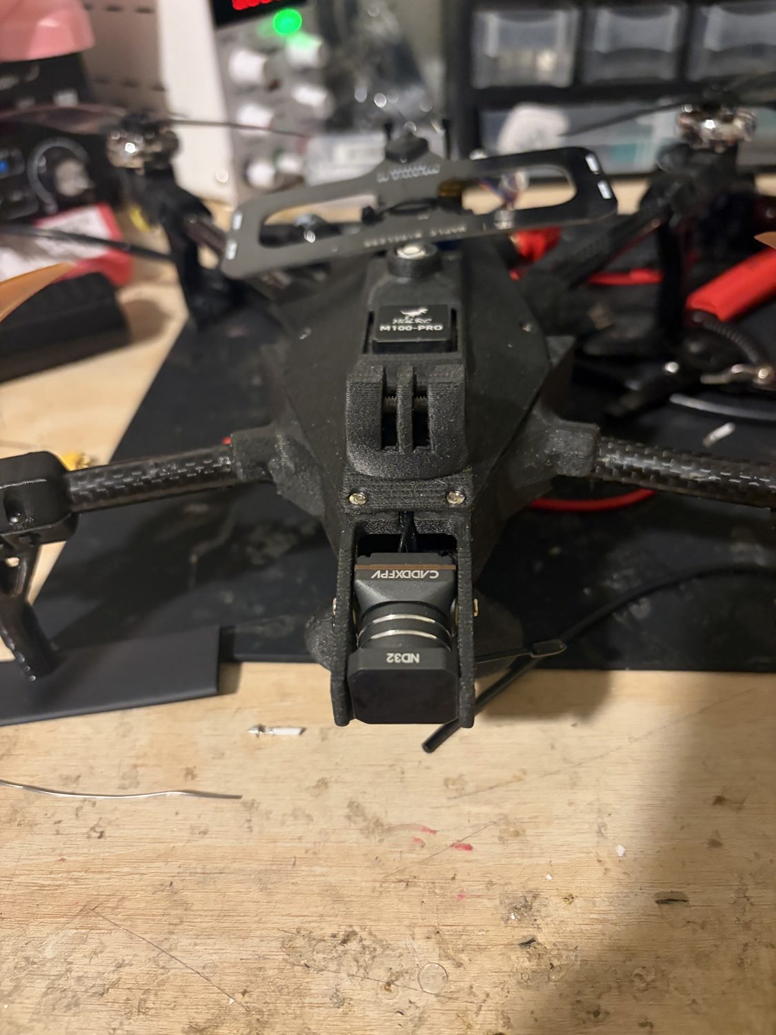 The custom 7 inch long-range quadcopter on a workbench