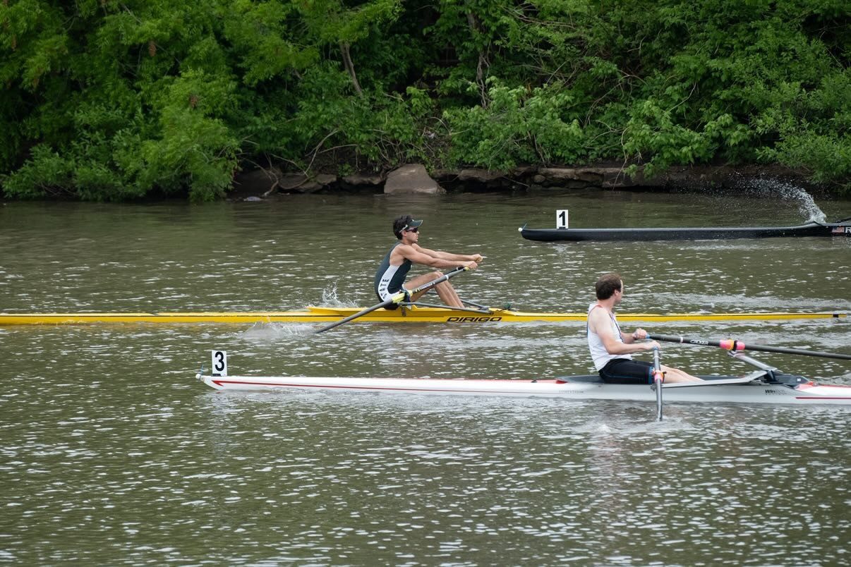 Wallace racing a single scull on a river
